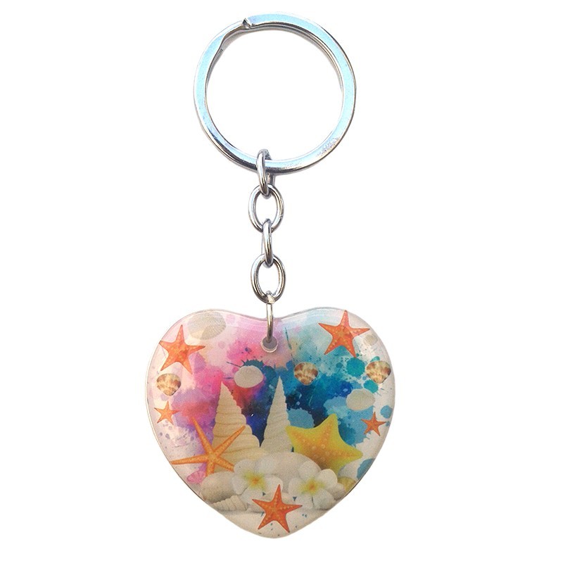 Breloc inima cu scoici metal si plastic- Orice lucru